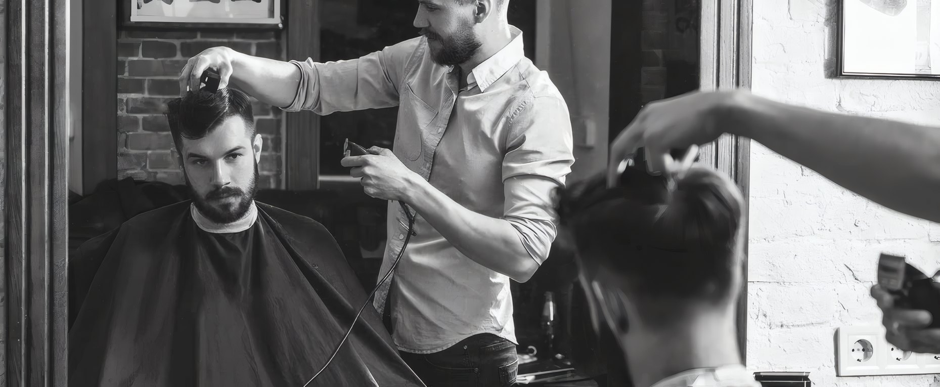 Two barbers at work side by side