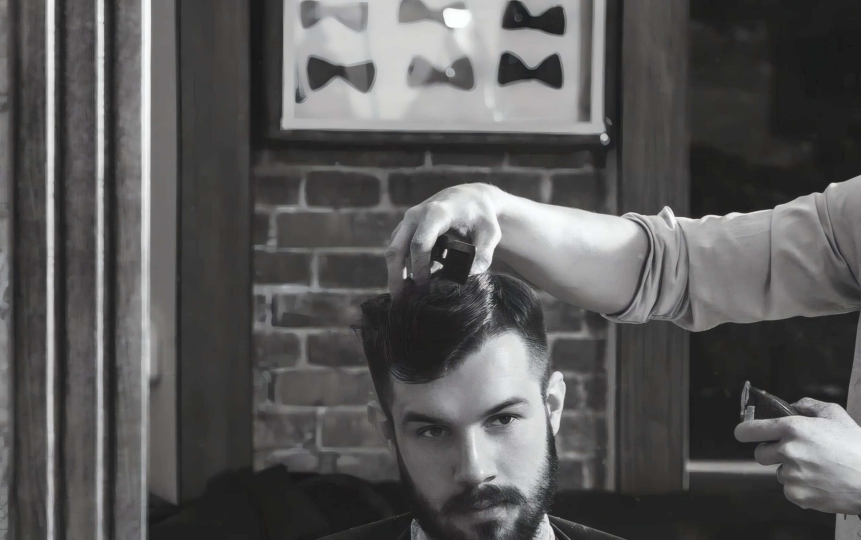 A barber trimming a client's hair in the mirror