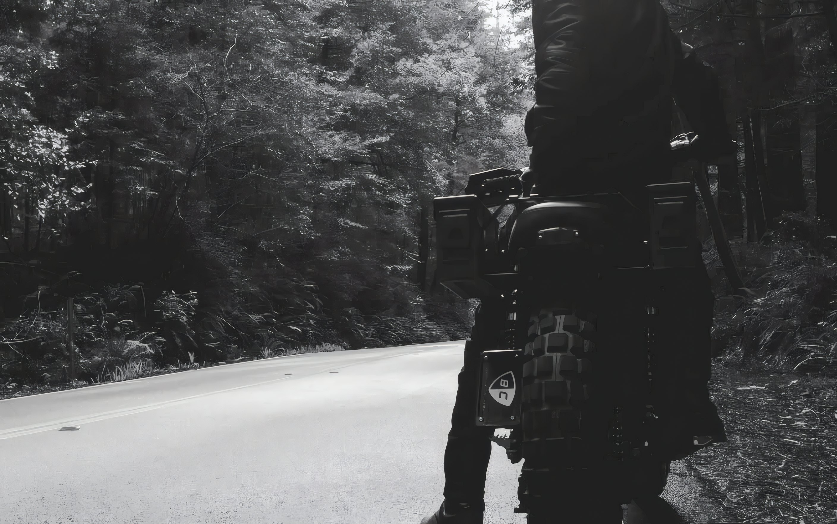 A rider and his motorcycle on a forest road