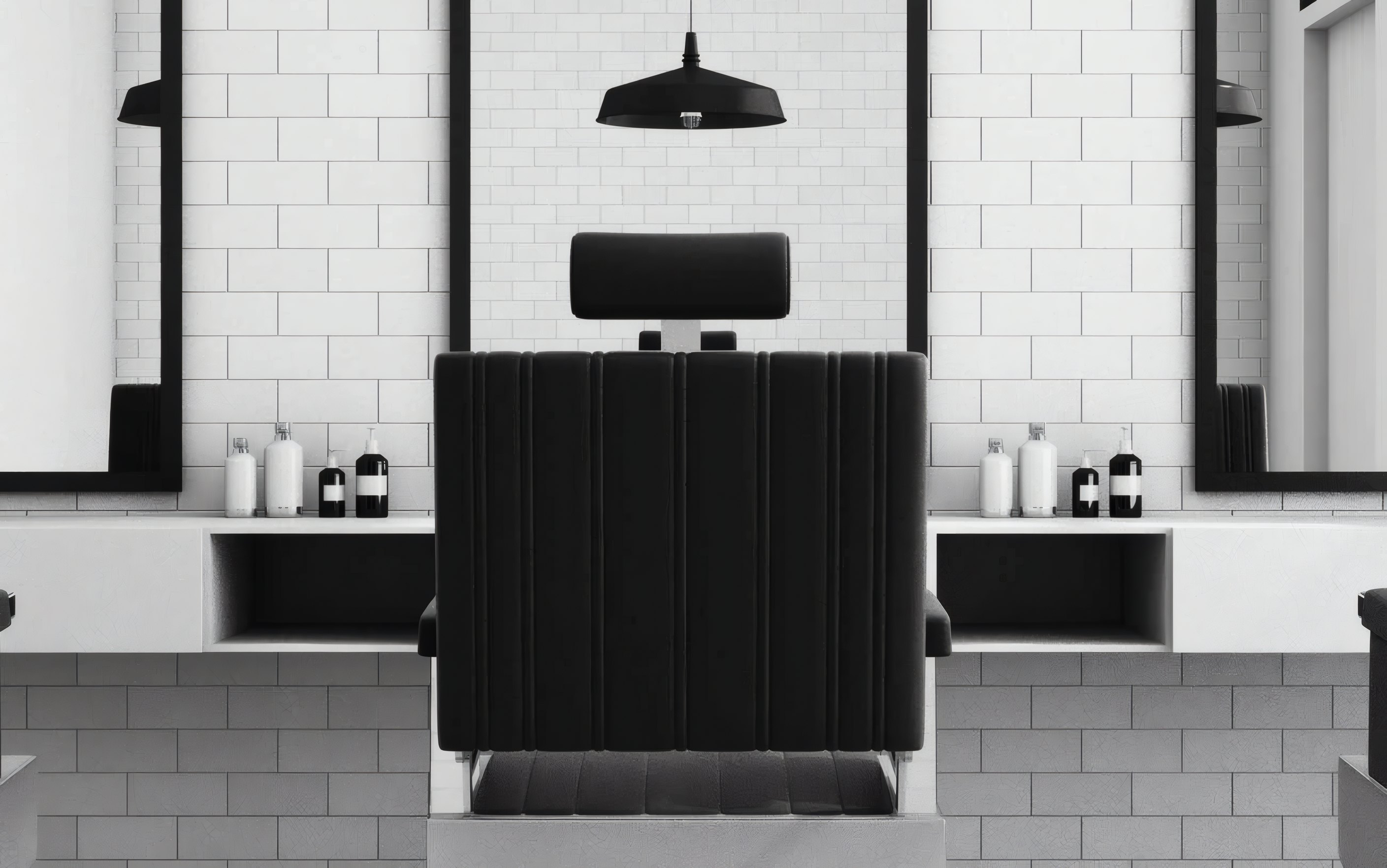 An empty barber chair between two mirrors