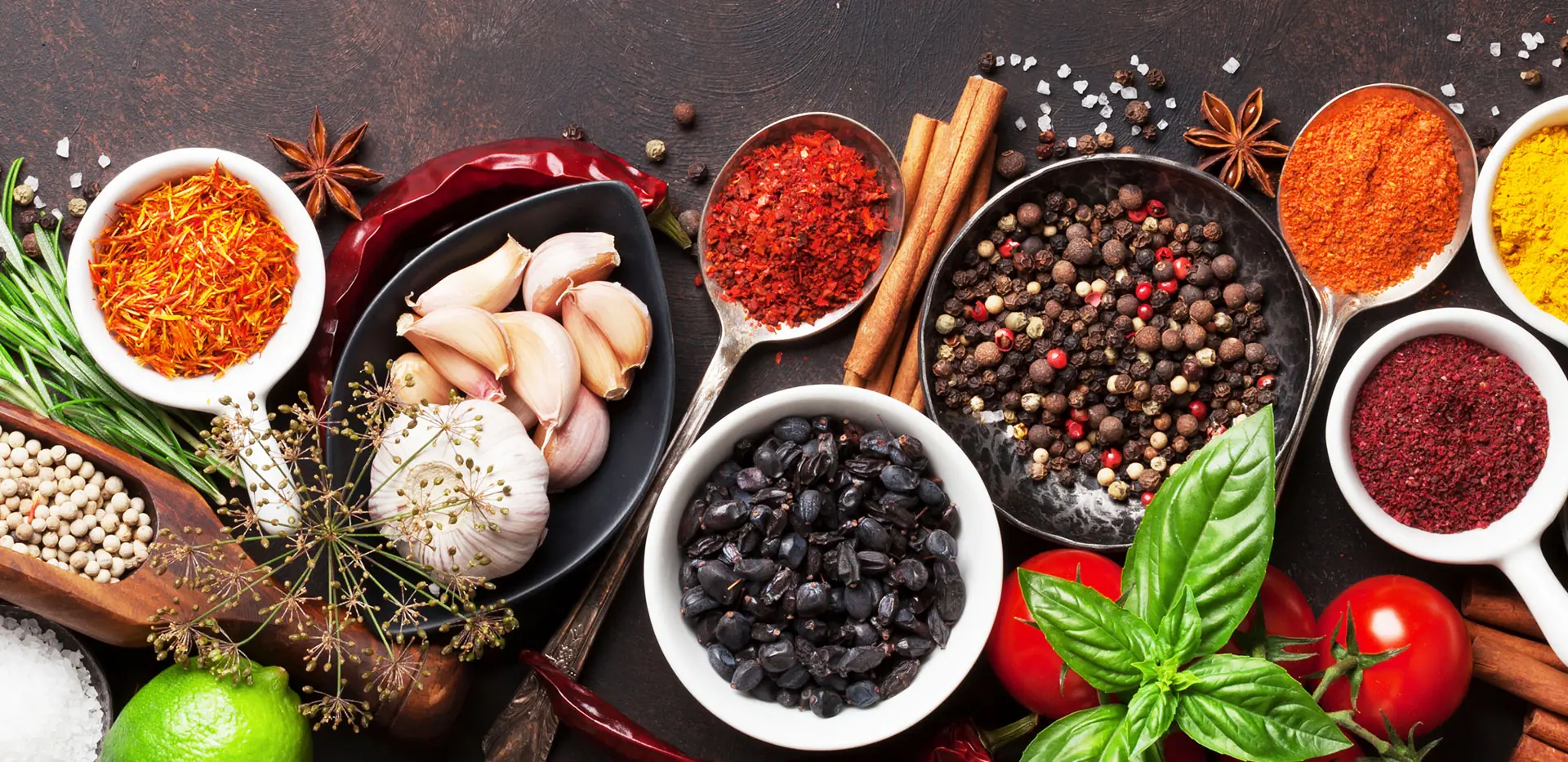Overhead spread of whole and ground spices with chillies