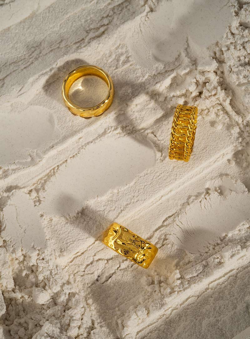 Two gold bands on white plaster