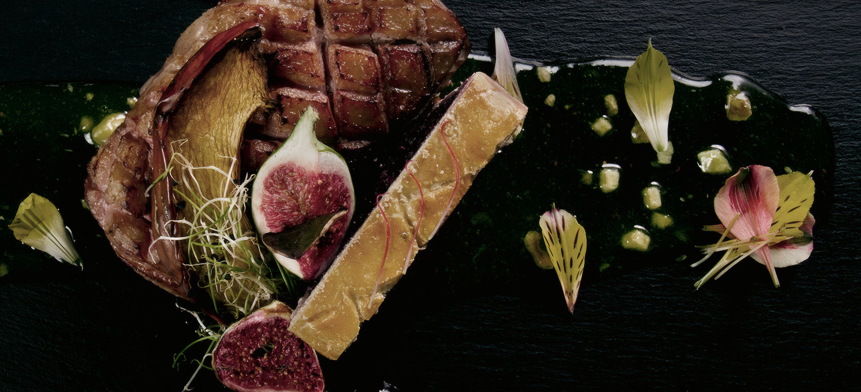 A crosshatched sear on a sliced cut with roasted figs