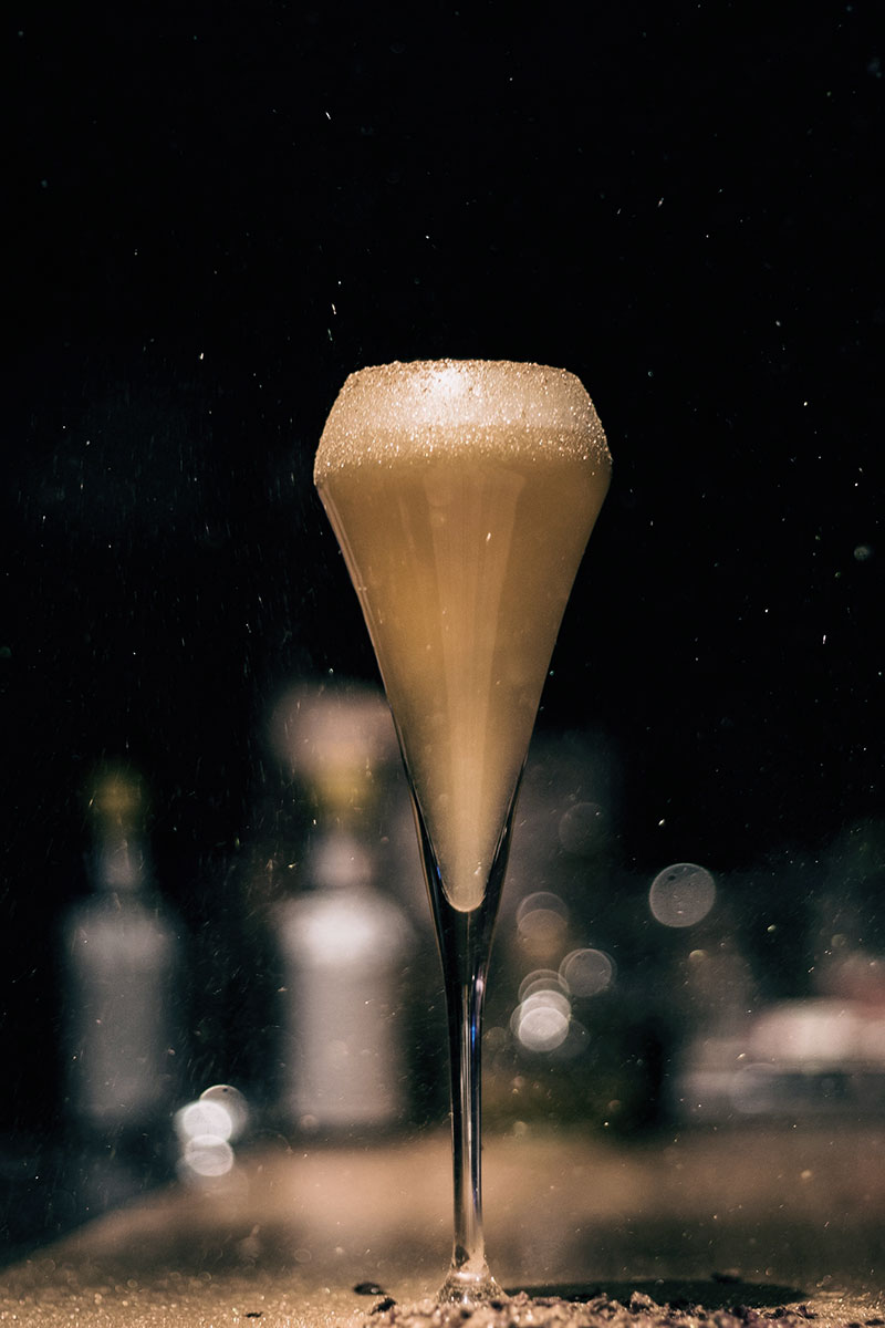 A tall glass on the bar