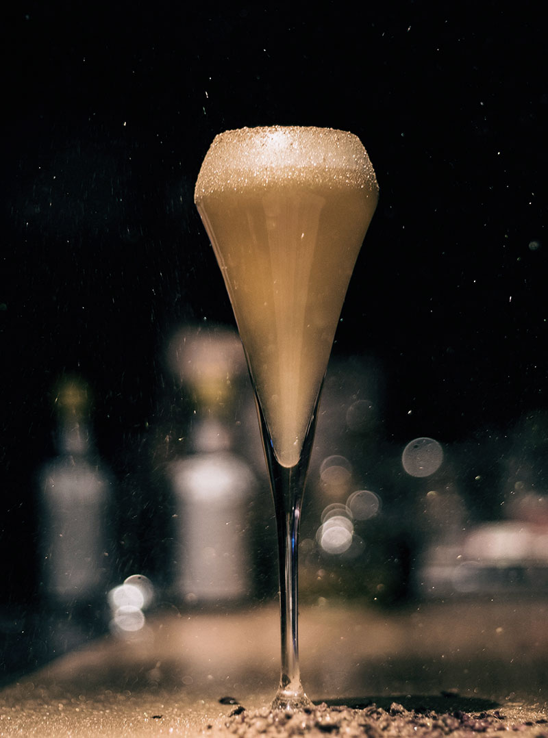 A tall glass on the bar
