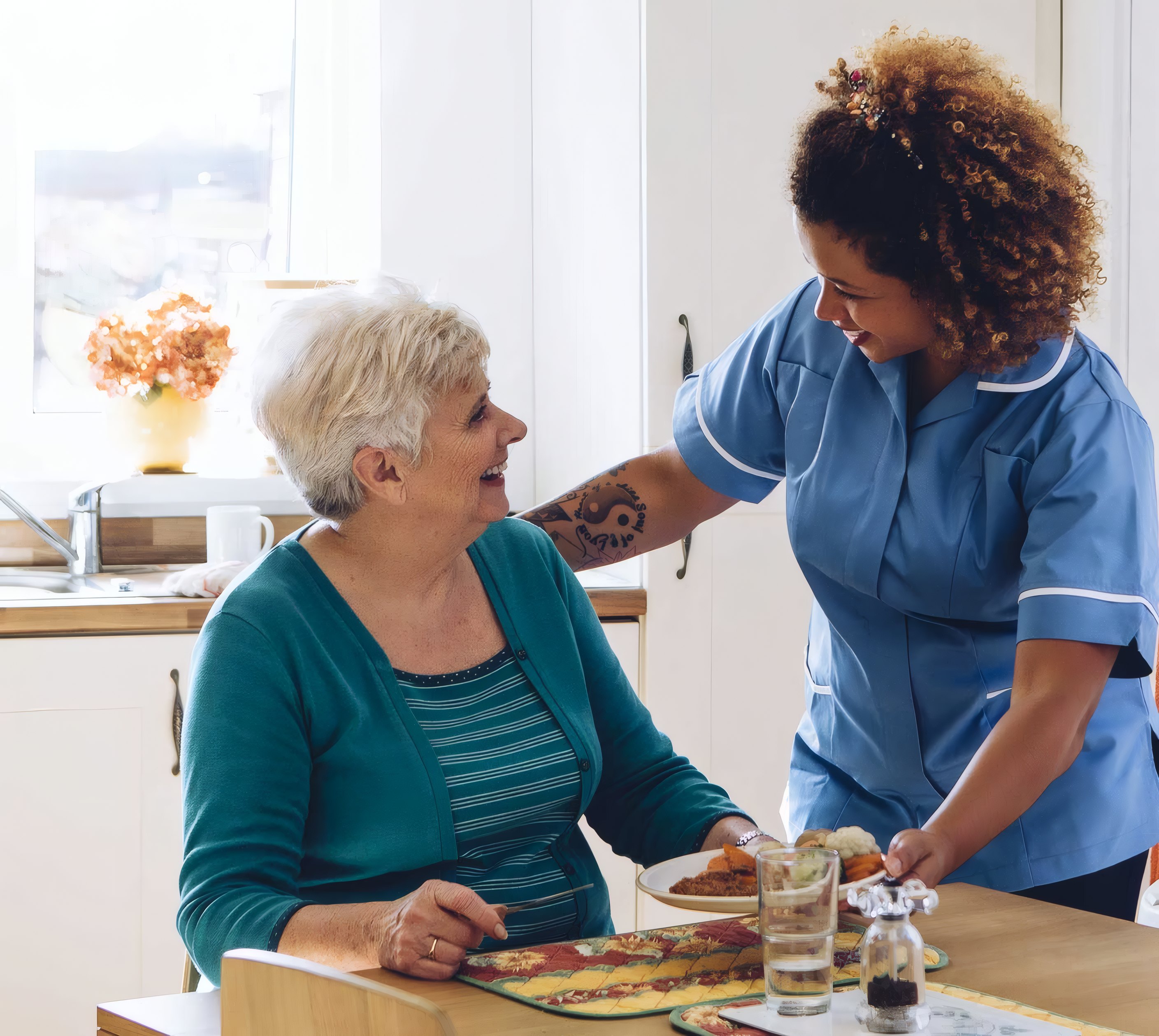 A carer sharing breakfast with a resident