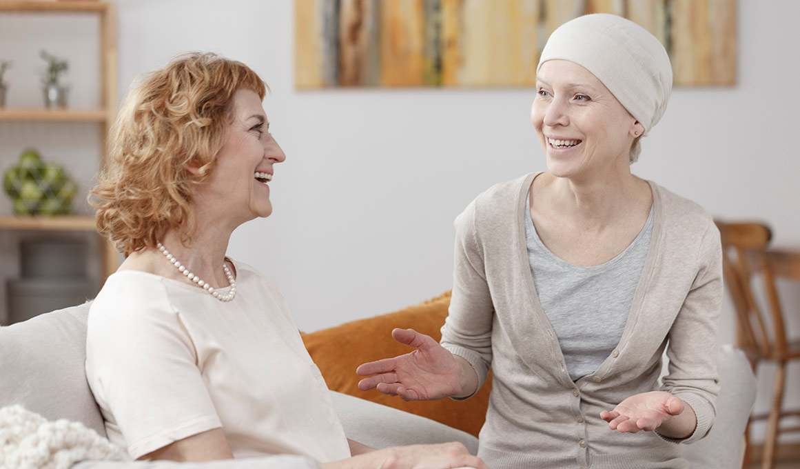 Two friends talking over a cup of tea
