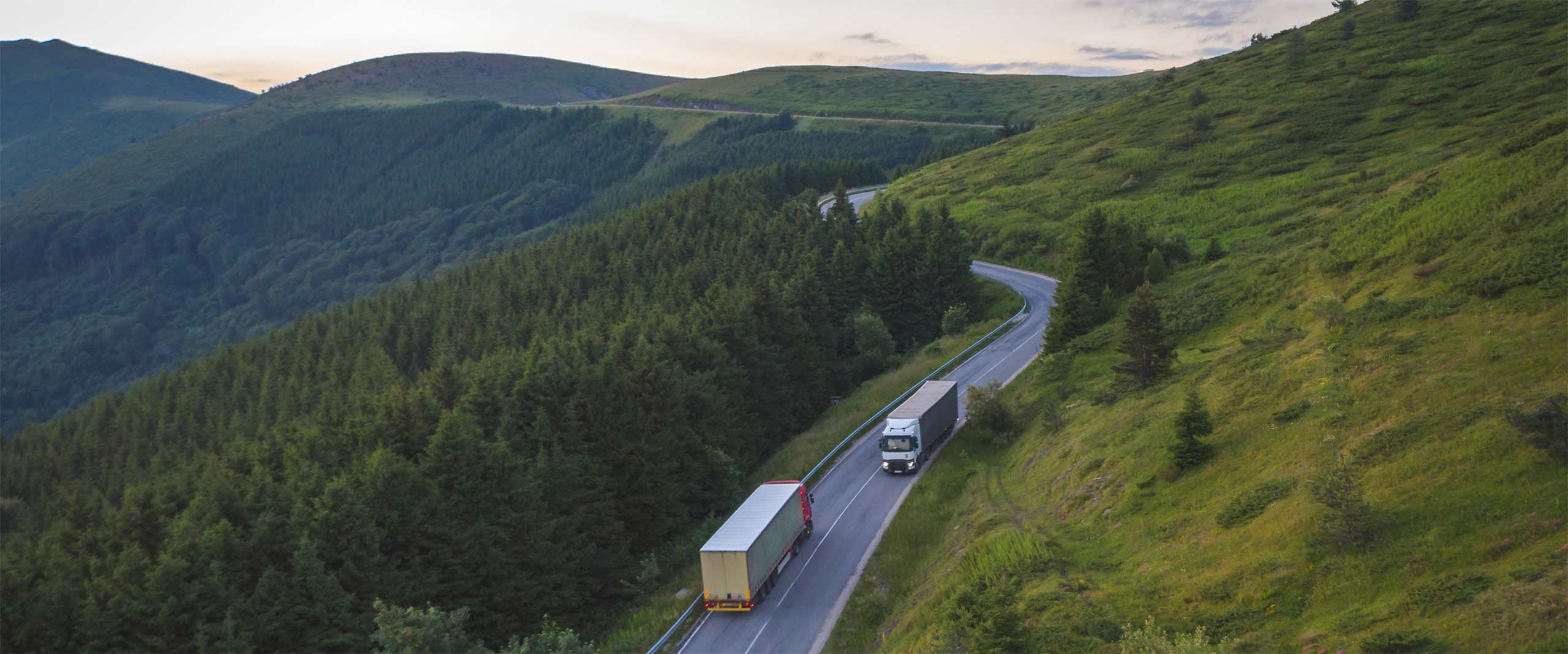 Two trucks on a mountain road