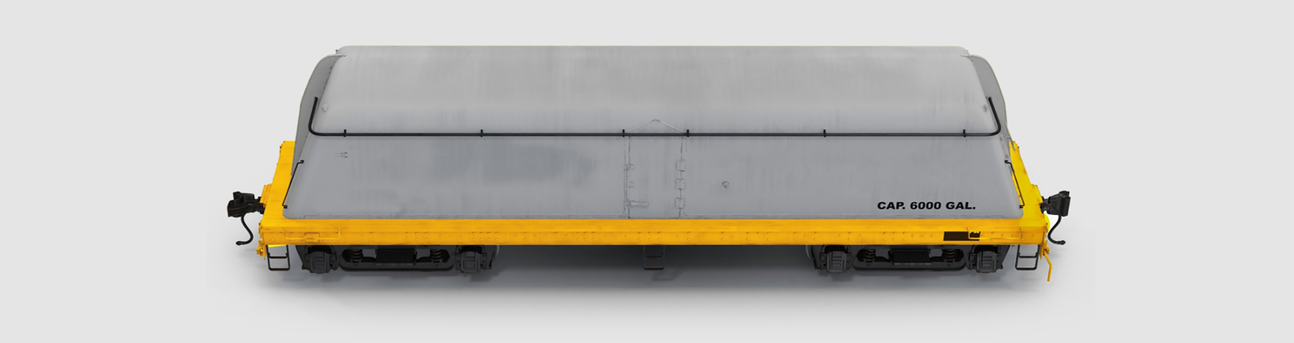 A covered hopper wagon on a yellow frame