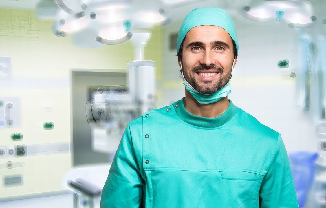 A smiling Clinexa surgeon in theatre scrubs