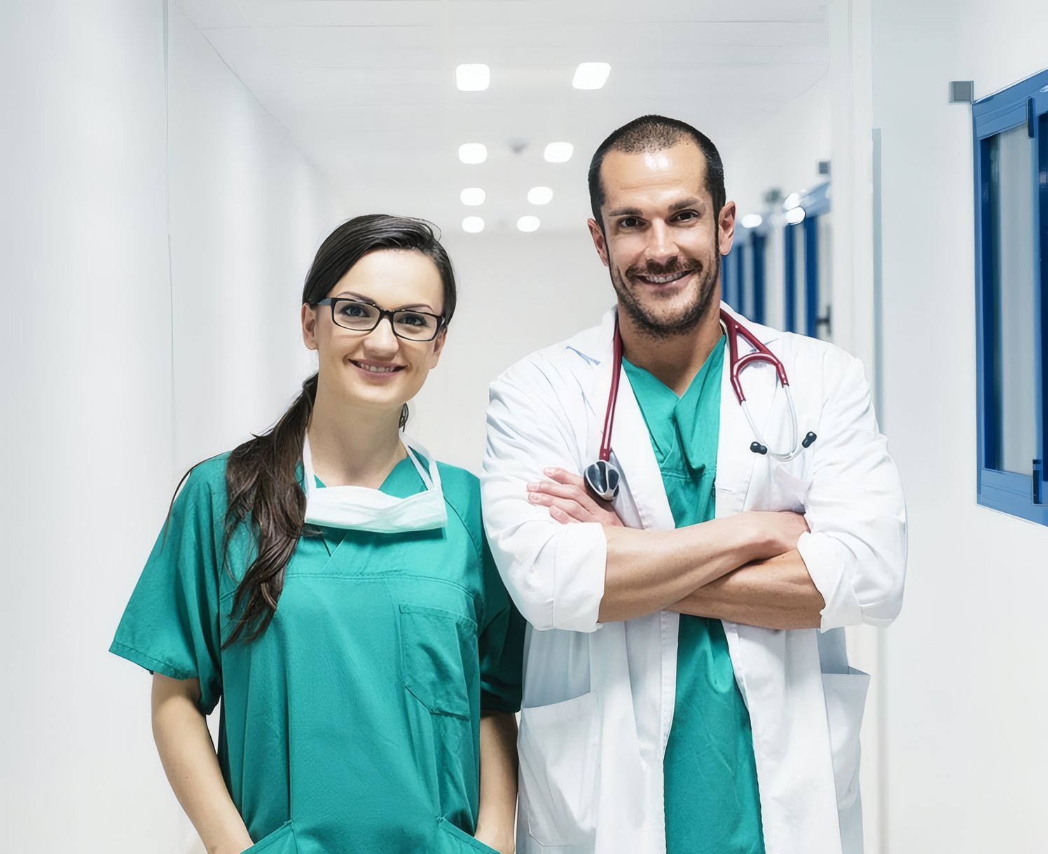 Two doctors smiling in the corridor