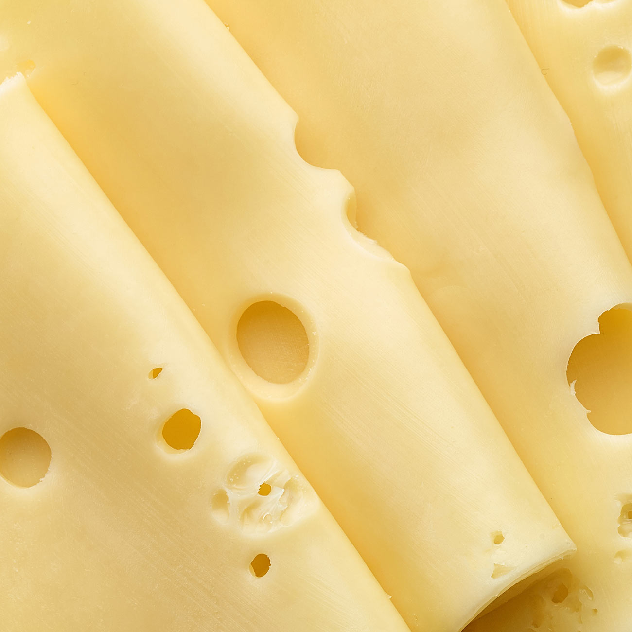 Sliced cheese with holes