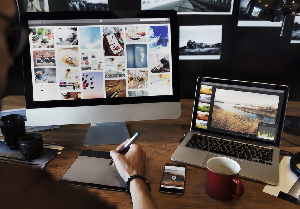 Prints laid out at the desk