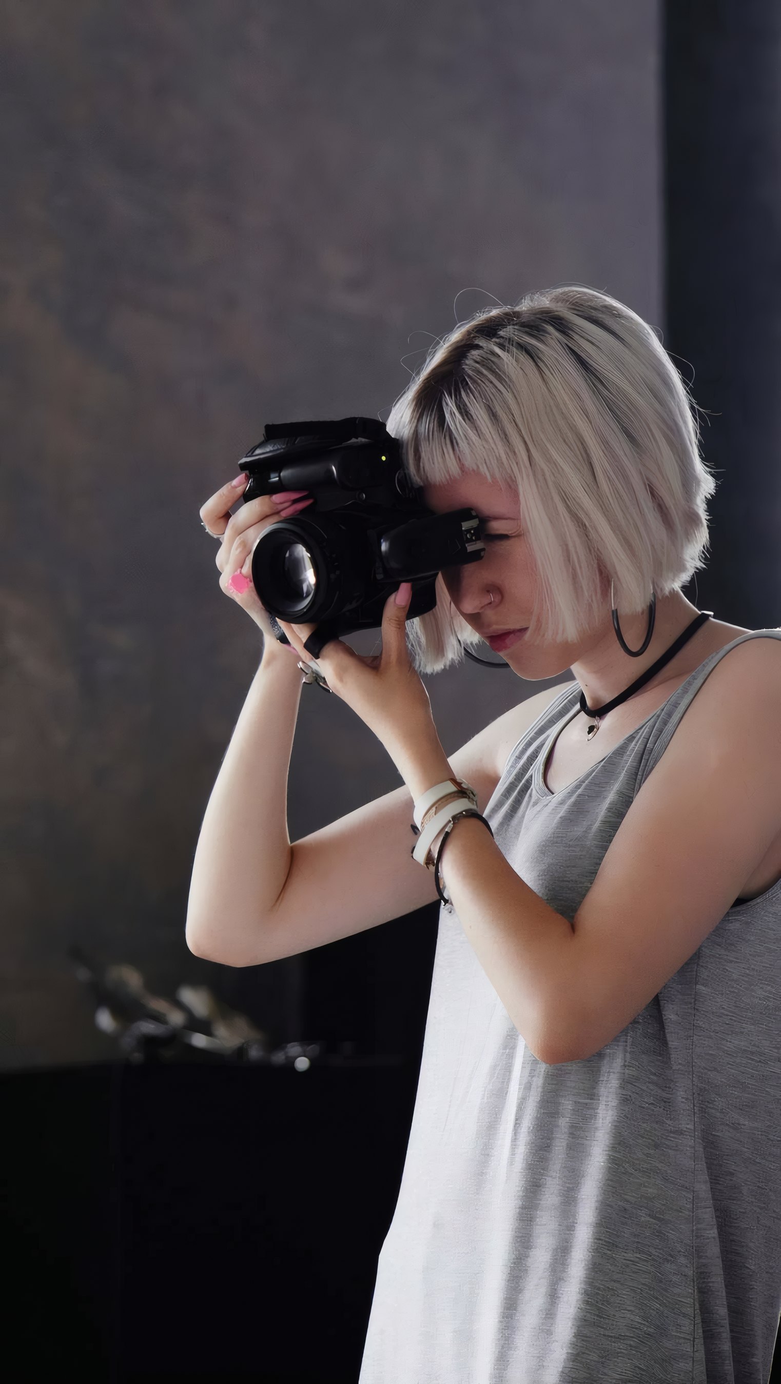 A photographer working under a beauty dish