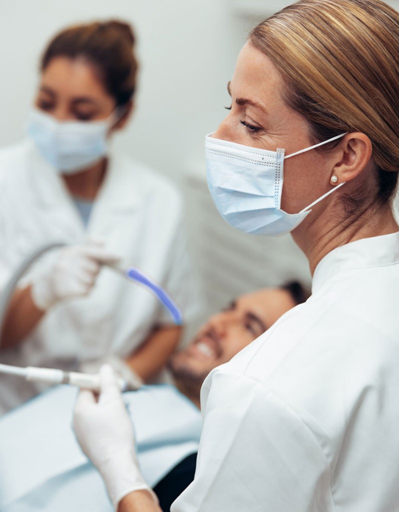 Two dentists smiling in the clinic