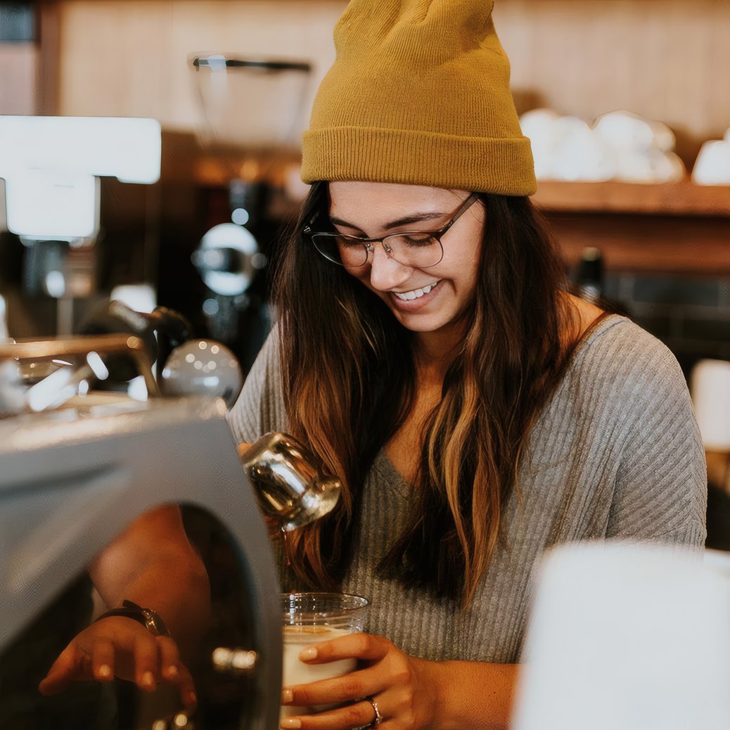 A barista steaming milk