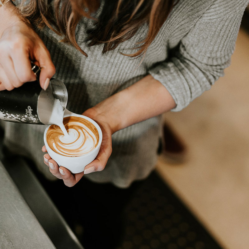 Latte art being poured