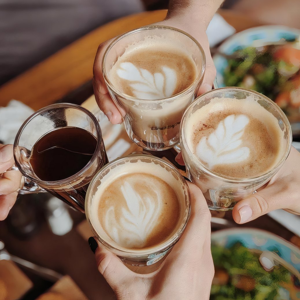 Guests raising flat whites