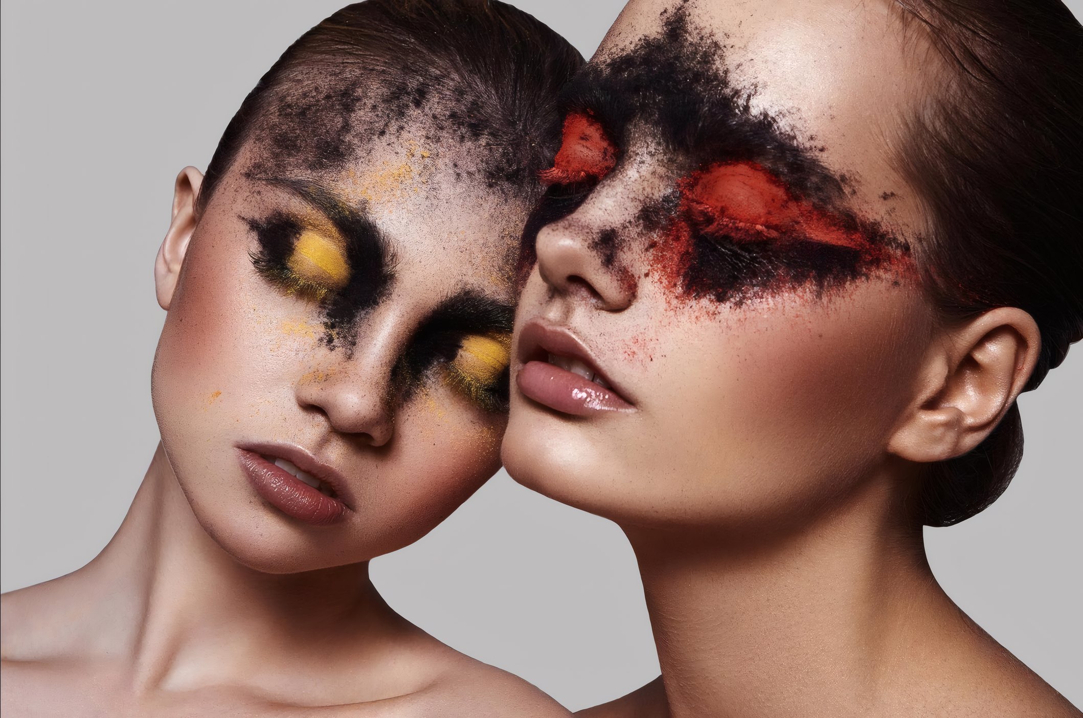 Two models in ash and ember eye make-up