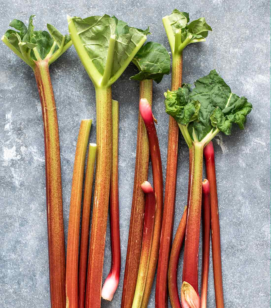 Rhubarb stalks on a stone table