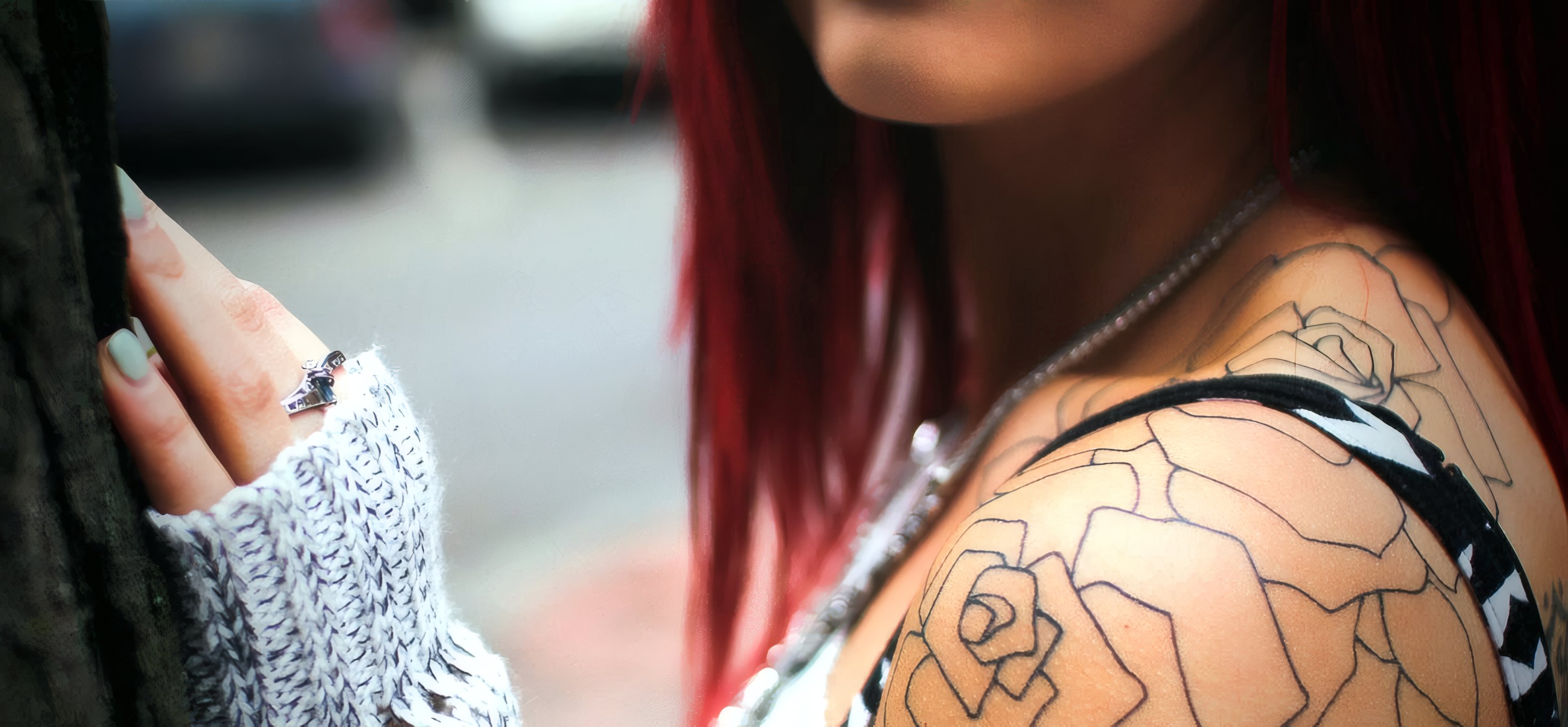 The outline of a rose on a shoulder, fresh from the needle