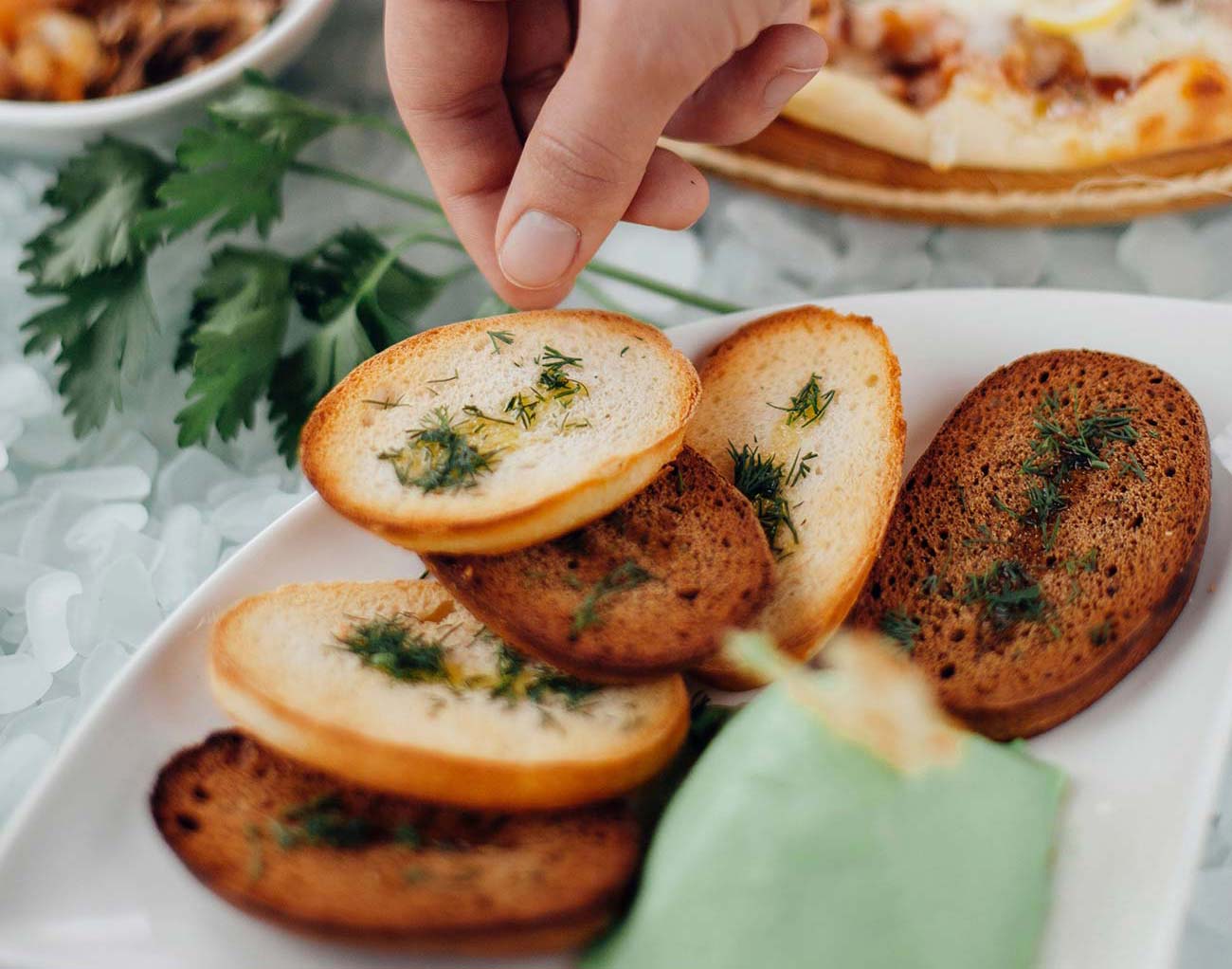 Garlic toasts with a green dip