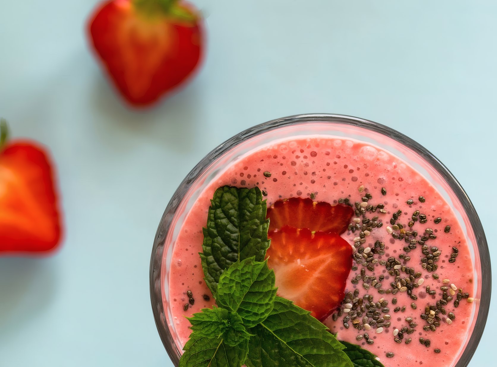 A strawberry smoothie bowl with mint and chia seeds