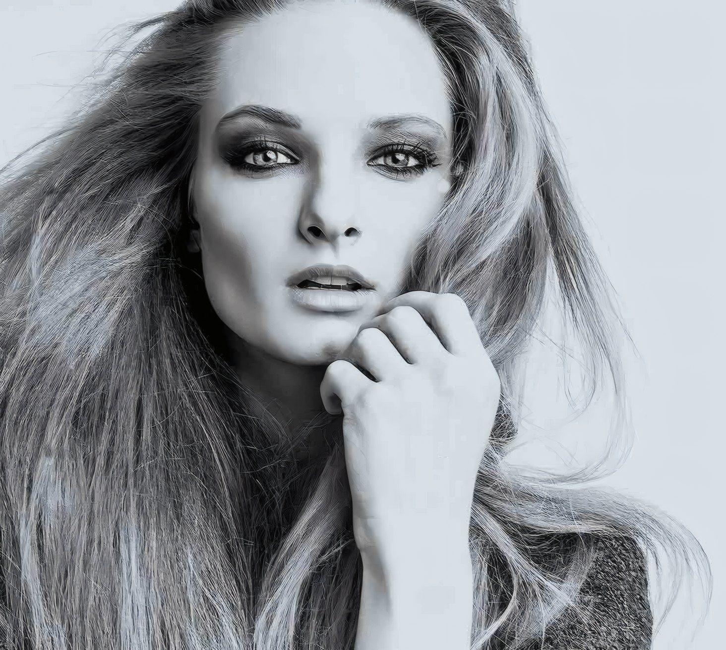A portrait in soft powder light, one hand at the cheek