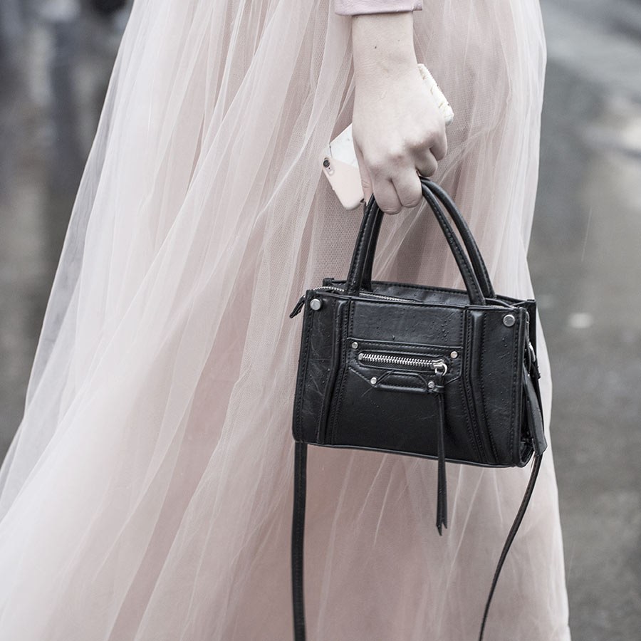 A tulle skirt and a black bag