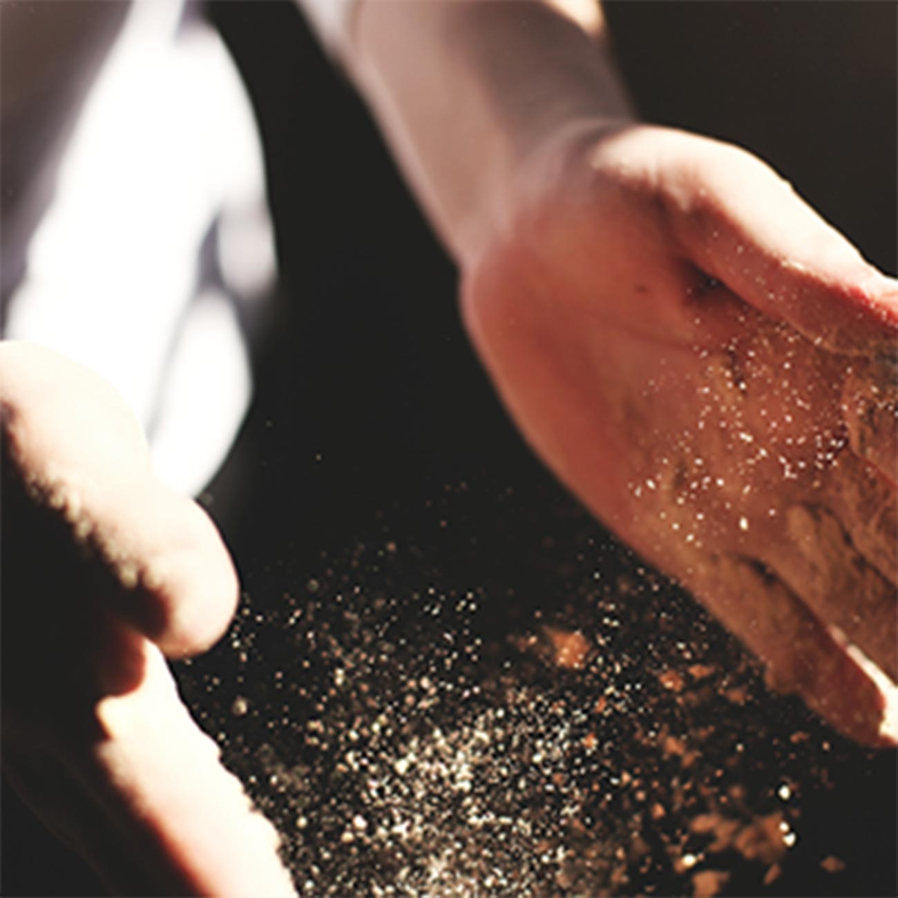 A cook's floured hands over the pasta board