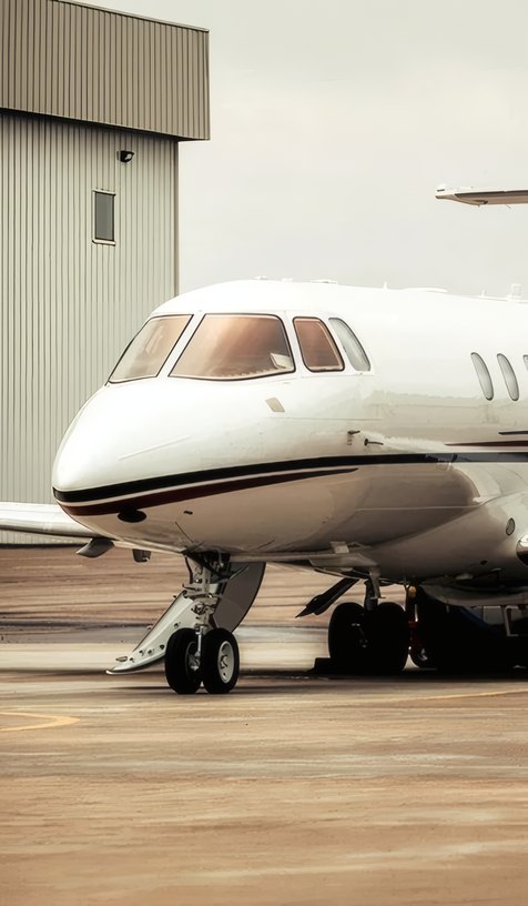 A jet waiting outside the hangar
