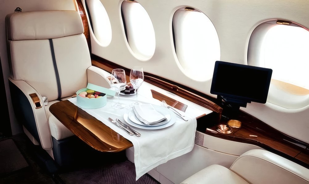 Champagne poured for travellers in the cabin