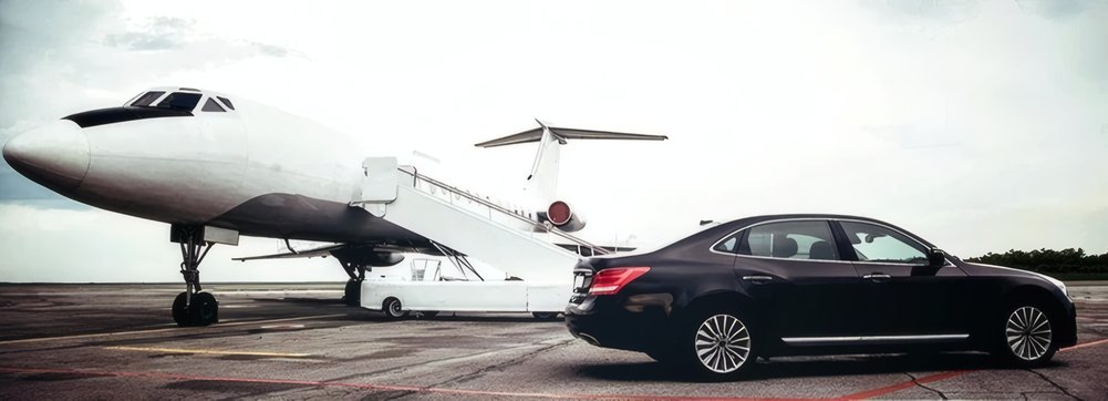A super-midsize jet with a waiting car