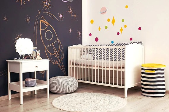 Nursery corner with a painted wall