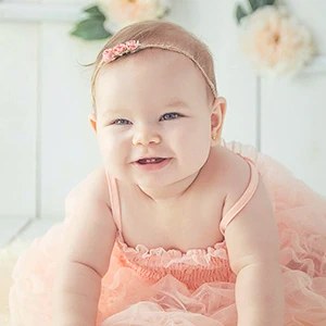 Thumbnail: baby reaching for a toy