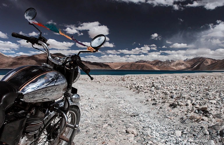 A motorcycle parked on a high mountain plateau