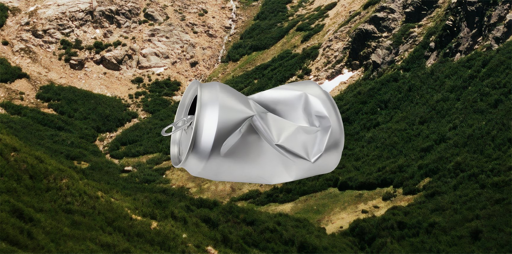 A crushed can resting on a mountain valley