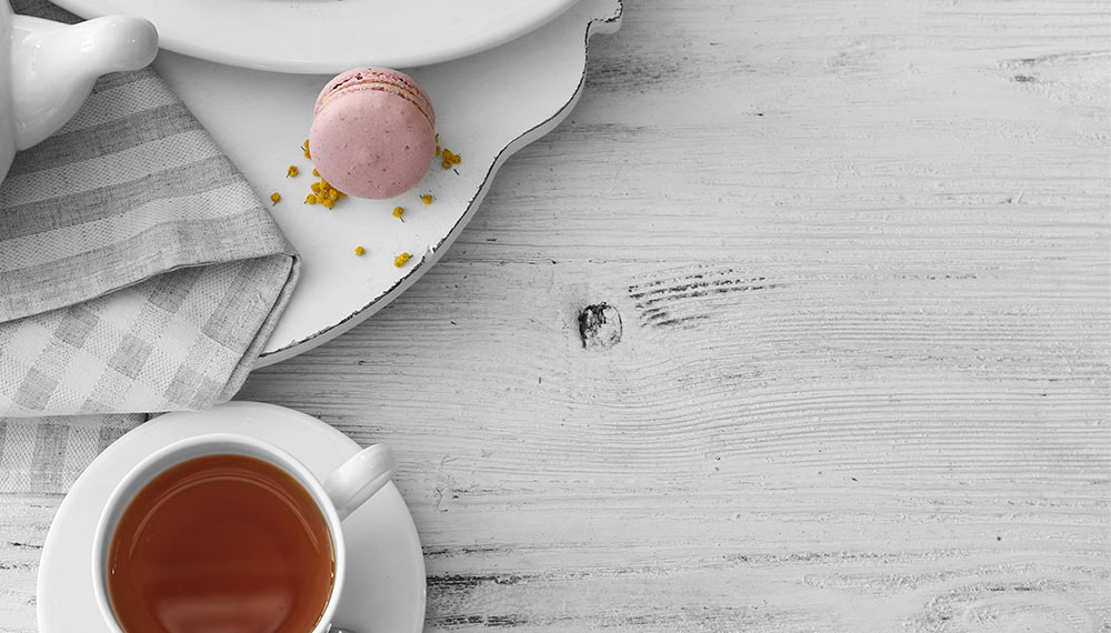 A cup of rooibos on a white table