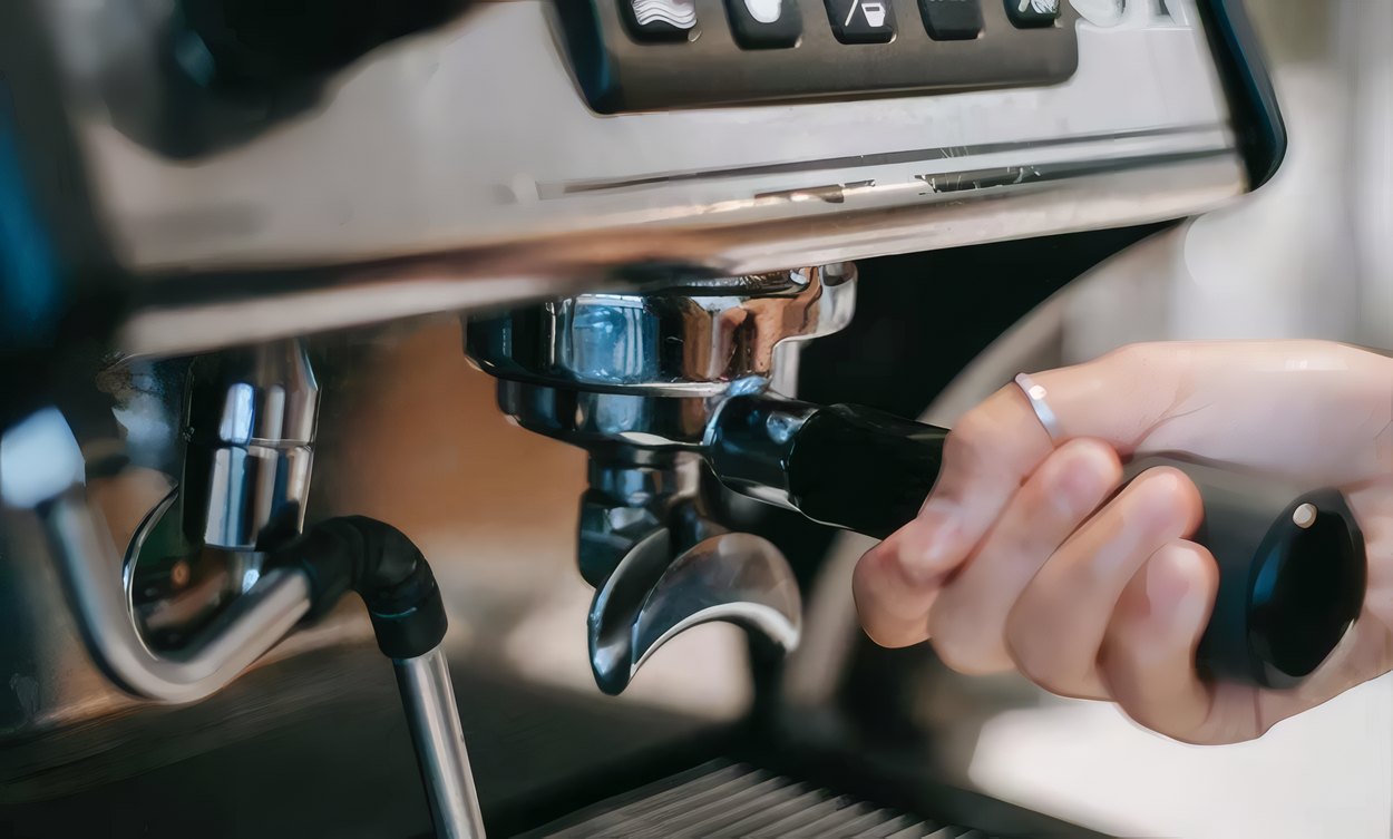 A cup filling under the espresso machine