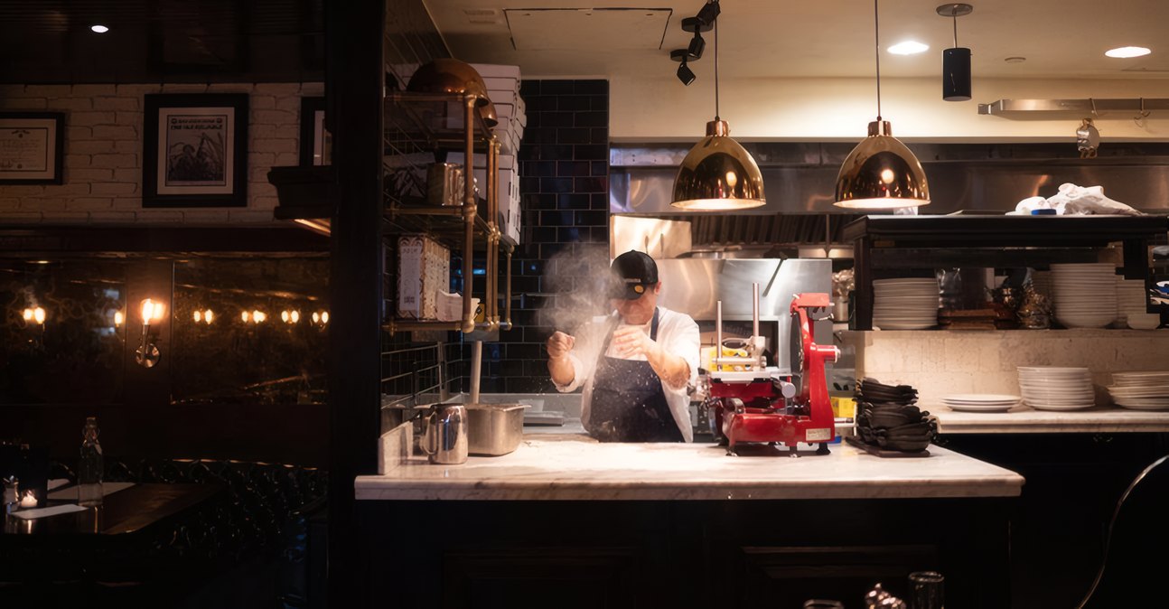 The kitchen pass under hanging lamps