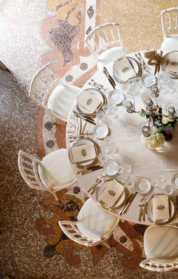 A round table laid for a celebration, seen from above