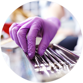 A laboratory technician sorting instruments