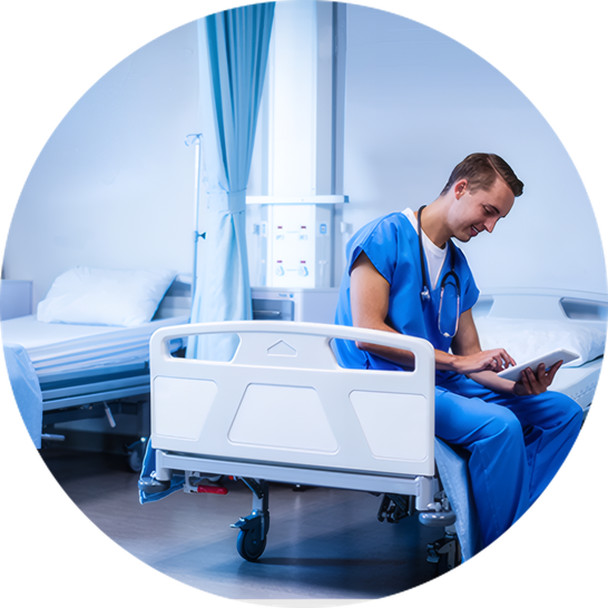 A nurse checking notes beside a patient's bed