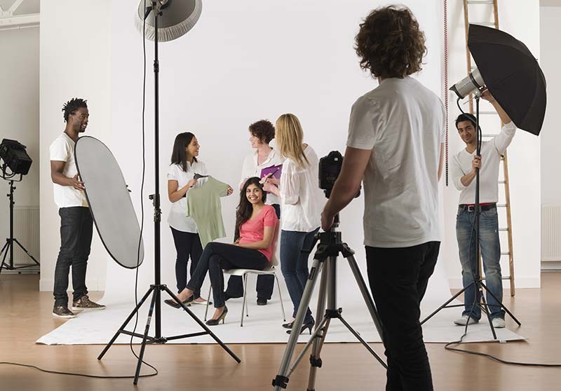 Students styling and shooting a look together