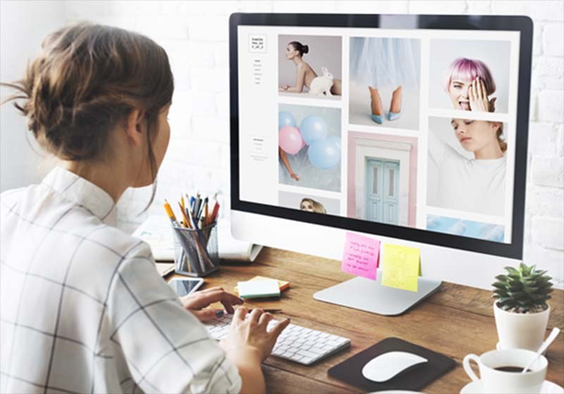 A student at a screen in the digital suite