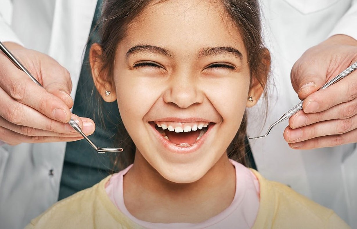 A girl smiling at her check-up