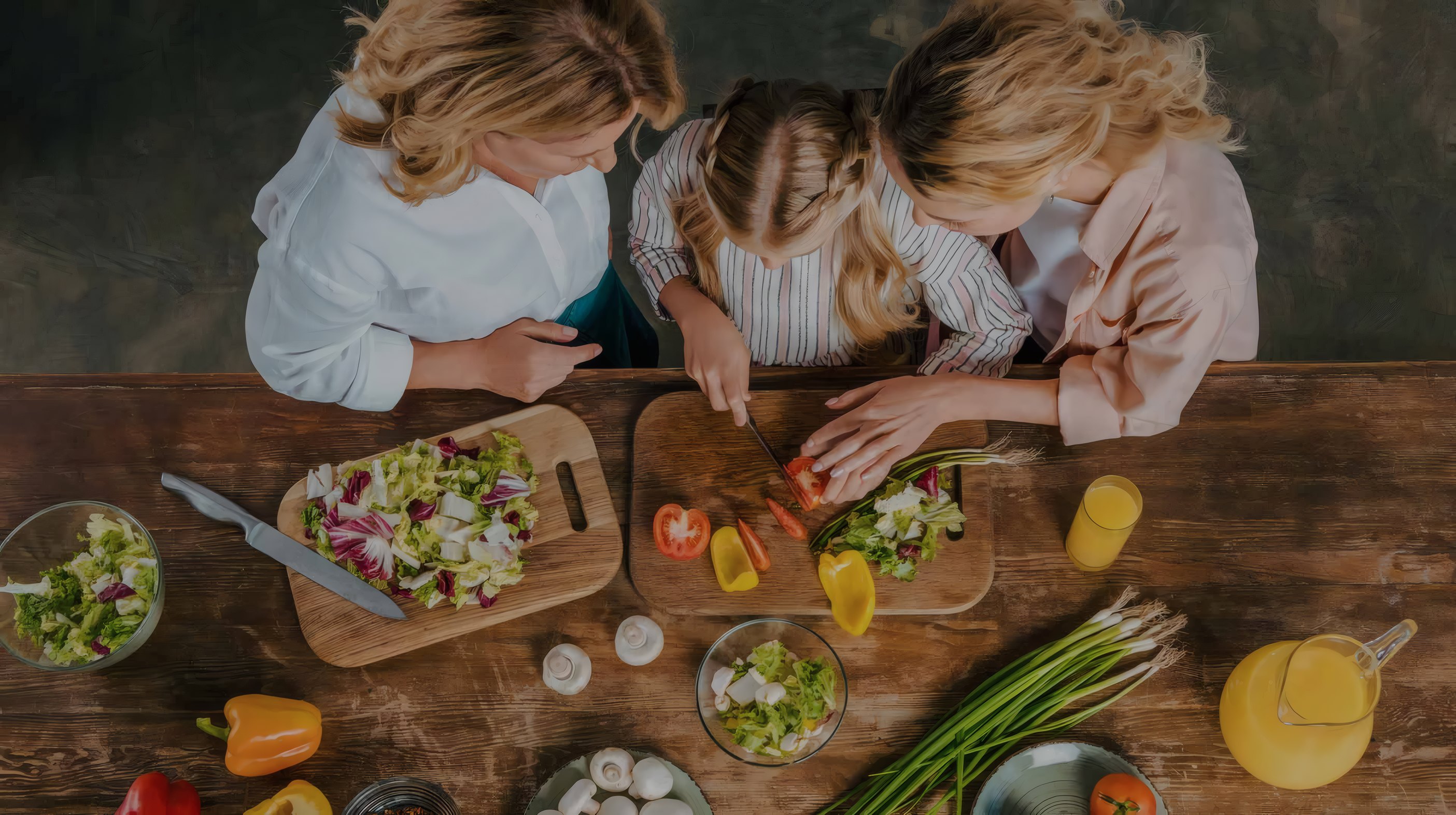 Friends cooking with fresh vegetables