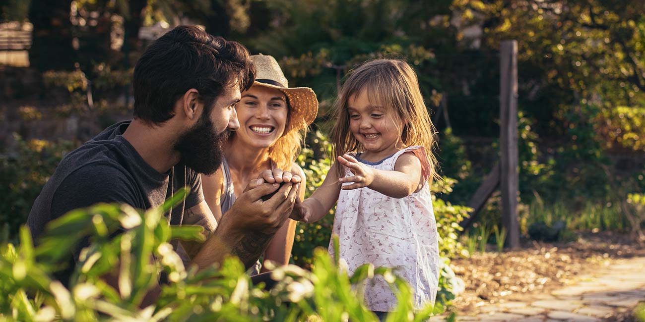 A family tasting produce at the farm