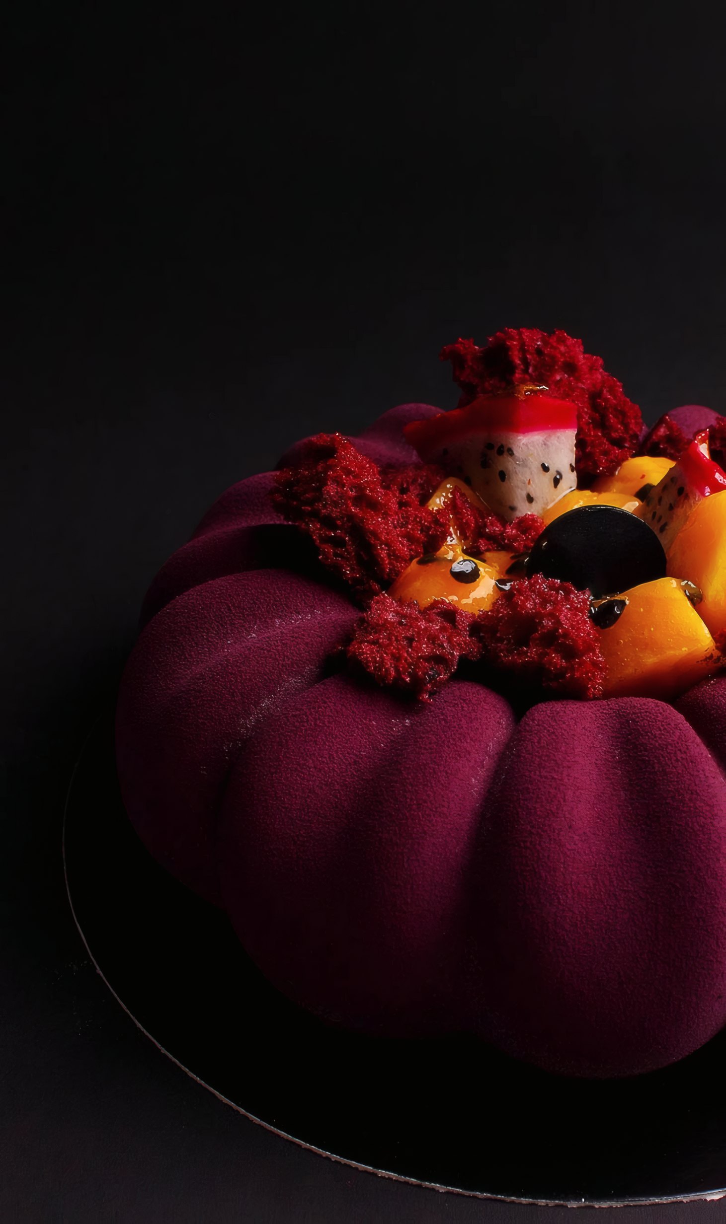 A burgundy velvet entremet crowned with flowers