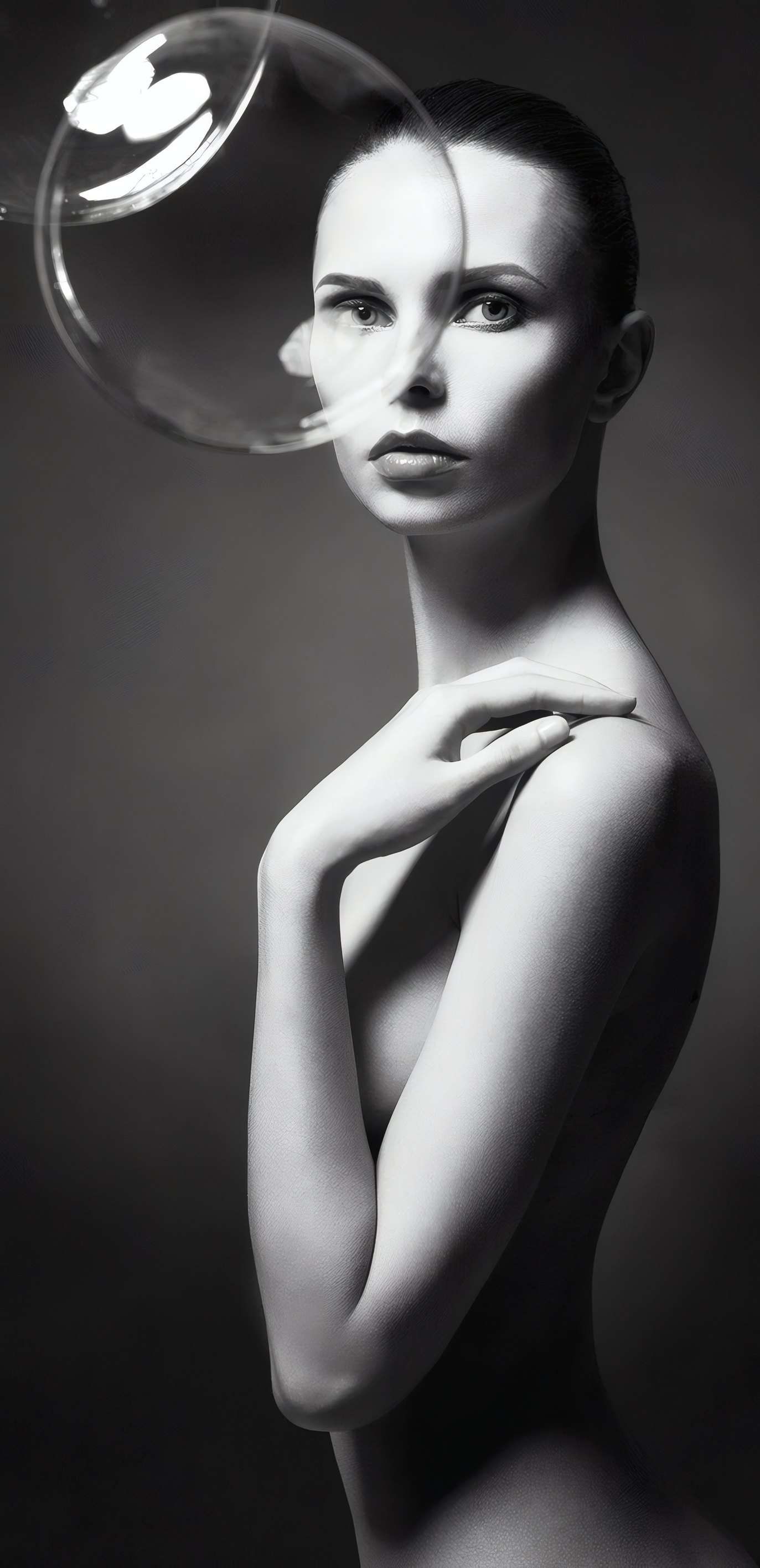 A portrait in black and white with a soap bubble